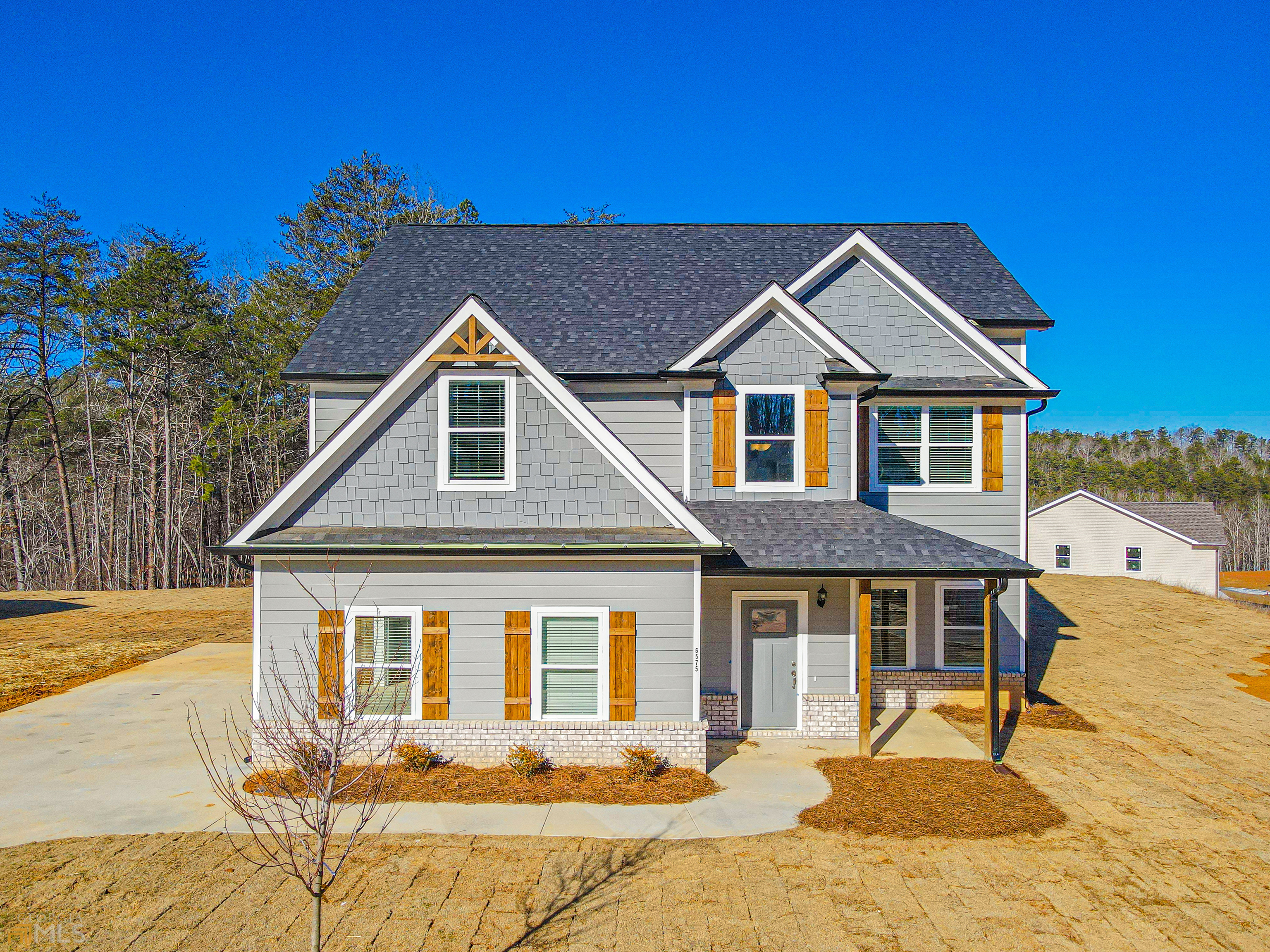 6596 River Station Drive Lula, GA 30554 - Photo 1 of 1 a front view of a house with a yard