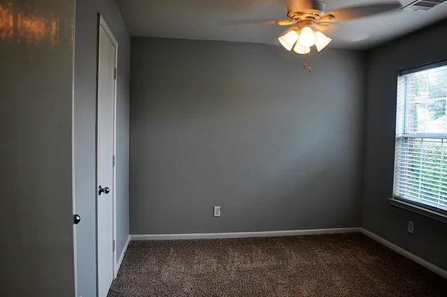 a bathroom with a shower and toilet