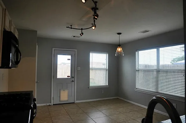 a view of an empty room with a window