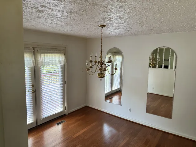 a view of livingroom with furniture and wooden floor