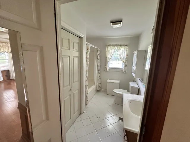 a bathroom with a sink and toilet