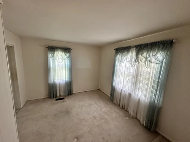 an empty room with windows