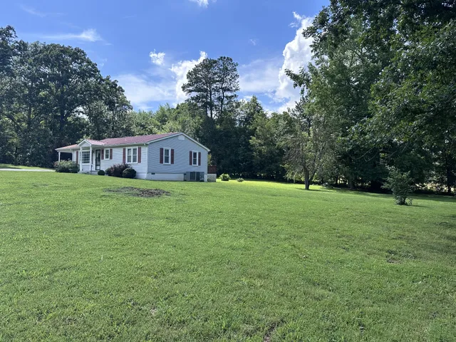 a view of a house with a big yard