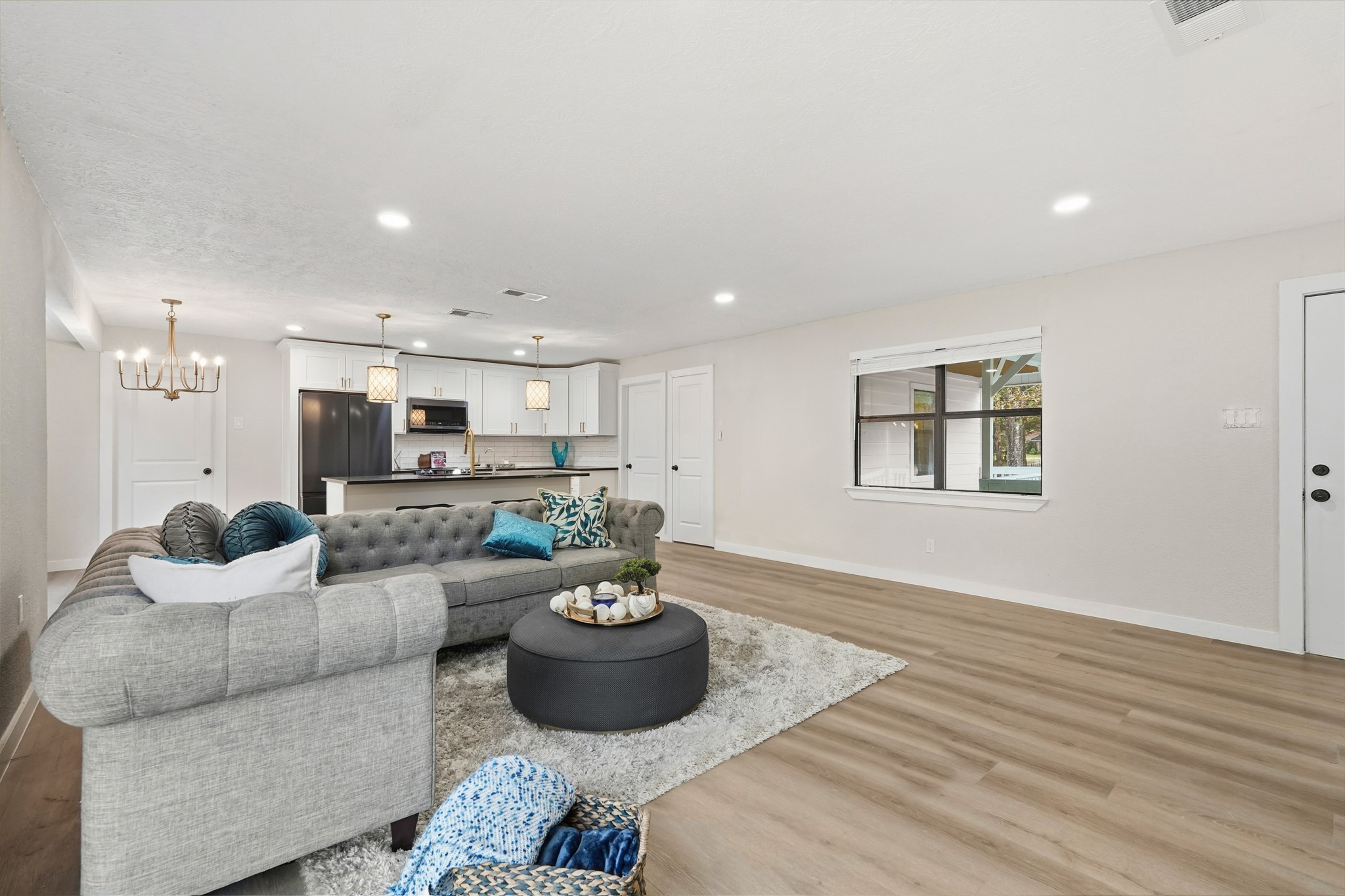24006 Crooked Creek Road Hockley, TX 77447 - Photo 12 of 25 a living room with furniture and a wooden floor