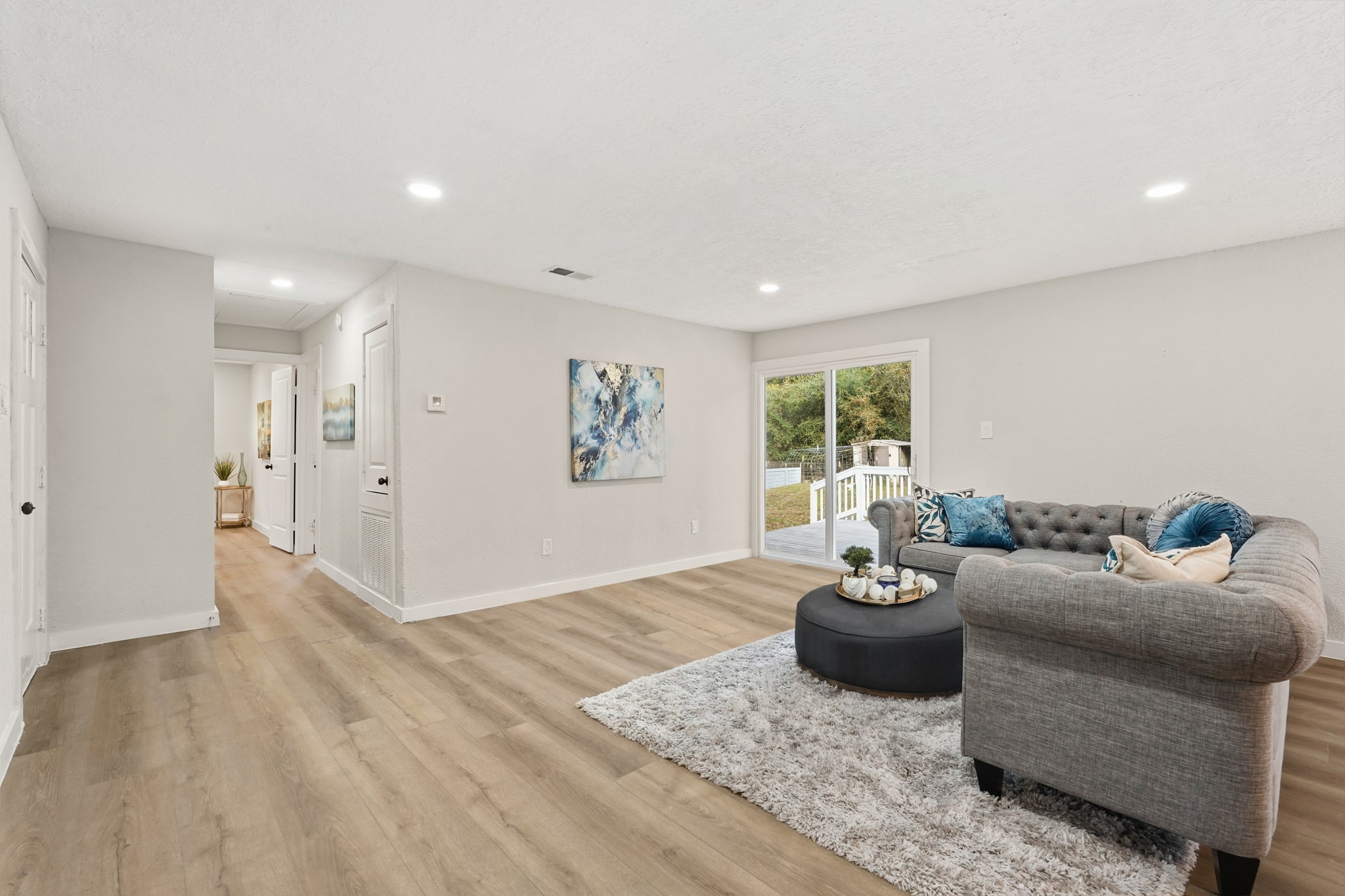 24006 Crooked Creek Road Hockley, TX 77447 - Photo 13 of 25 a living room with furniture and a window