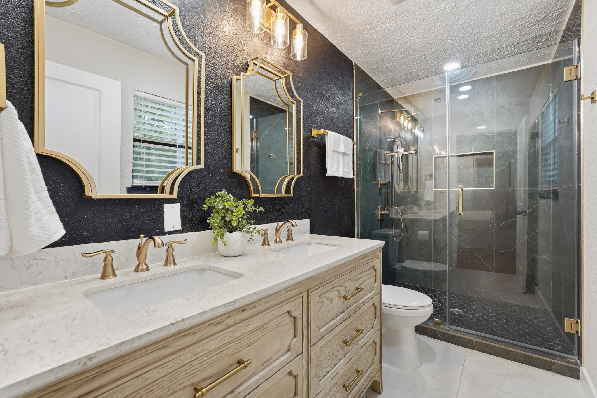 24006 Crooked Creek Road Hockley, TX 77447 - Photo 15 of 25 a bathroom with a granite countertop sink a toilet and shower