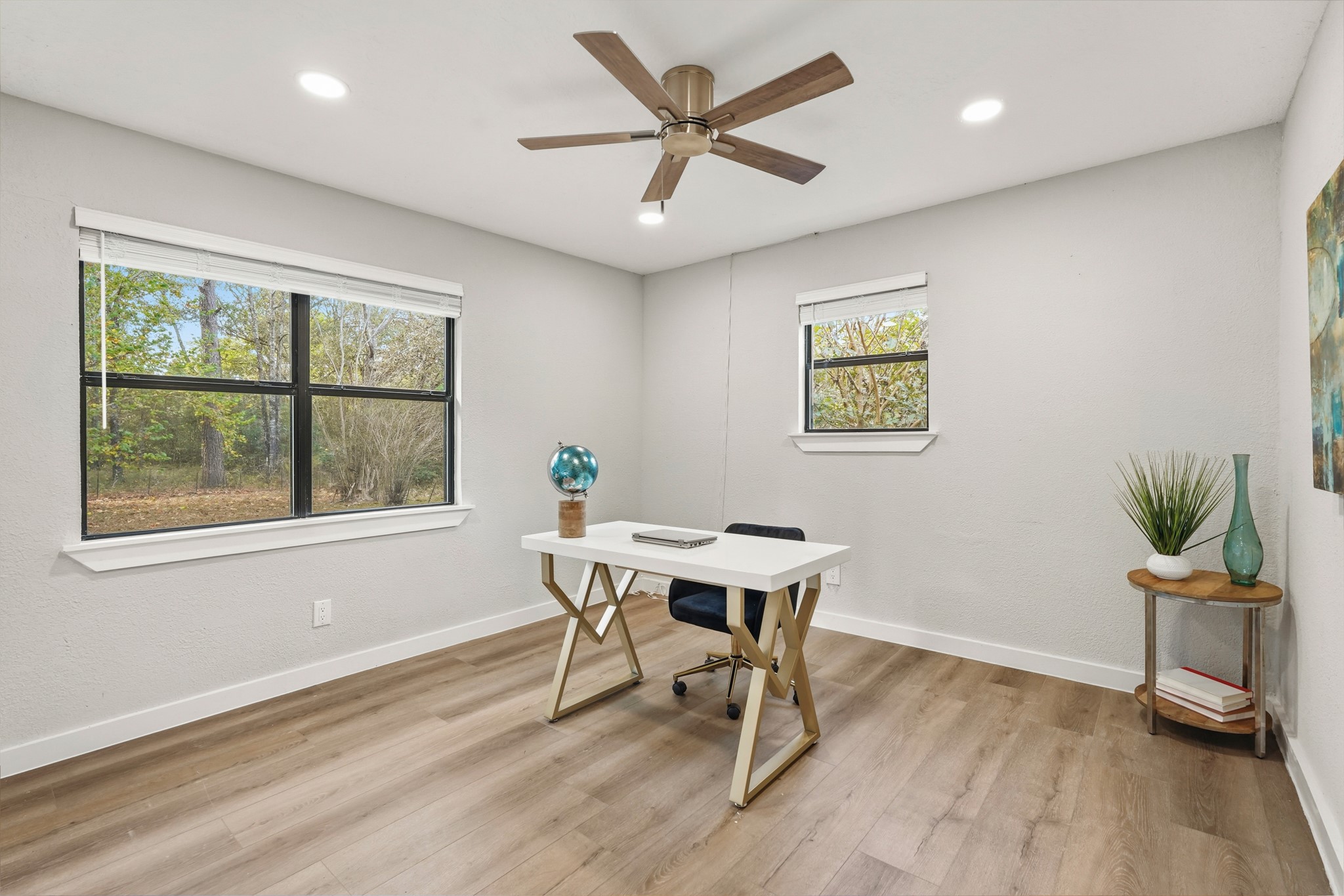 24006 Crooked Creek Road Hockley, TX 77447 - Photo 16 of 25 a workspace with furniture window and wooden floor