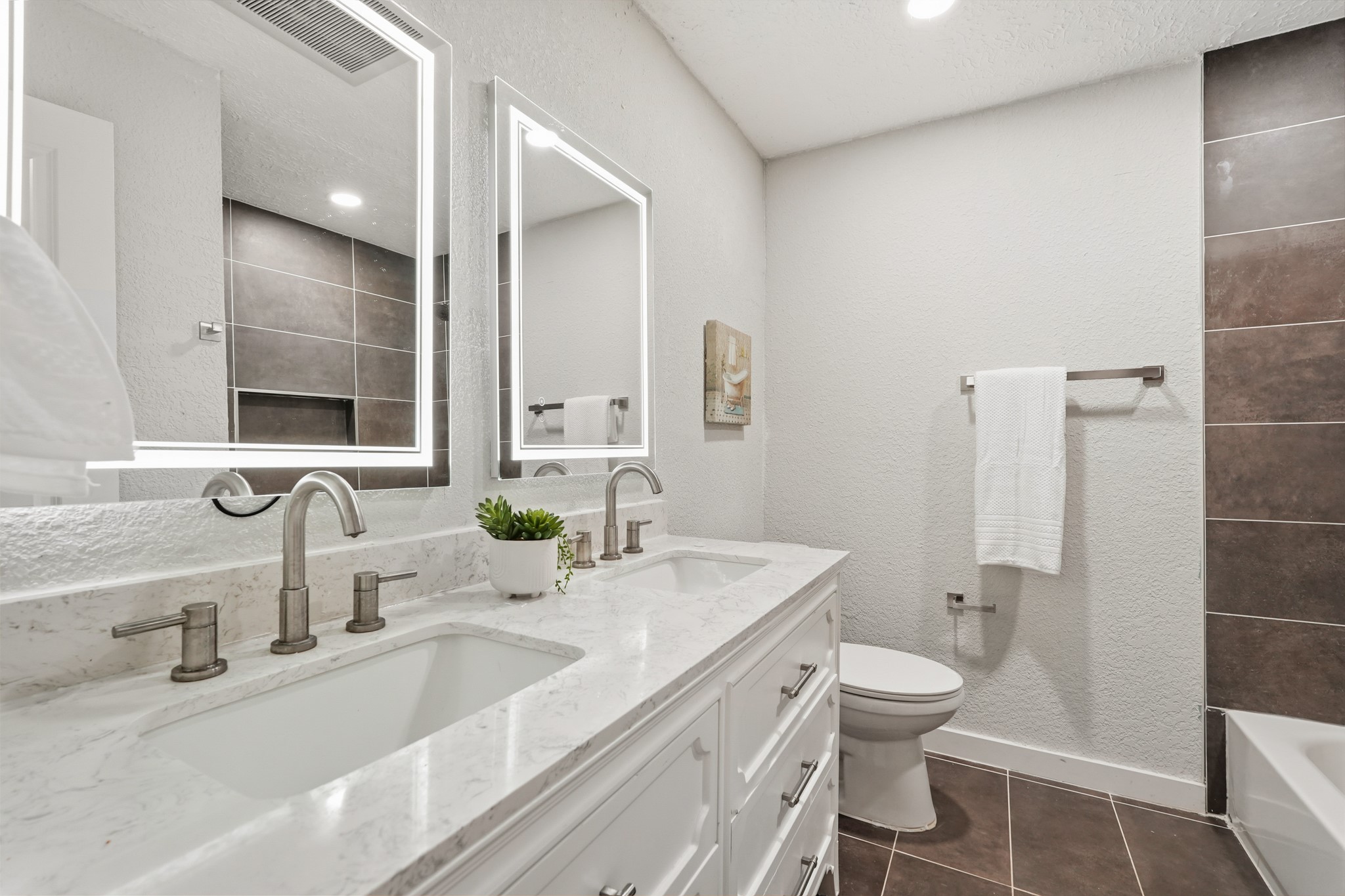 24006 Crooked Creek Road Hockley, TX 77447 - Photo 17 of 25 a bathroom with a double vanity sink toilet and shower