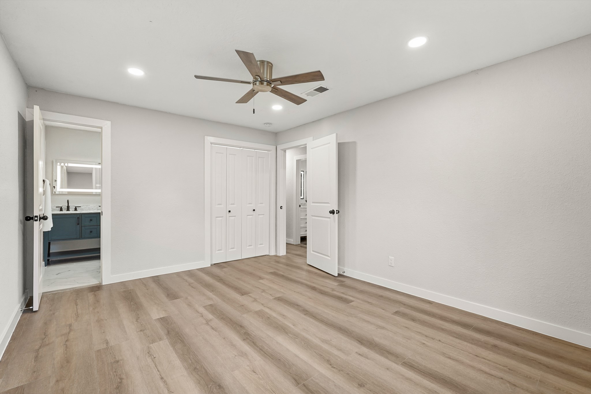 24006 Crooked Creek Road Hockley, TX 77447 - Photo 19 of 25 wooden floor in an empty room with a window