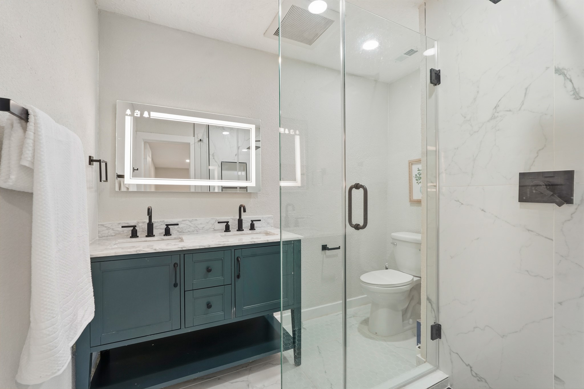 24006 Crooked Creek Road Hockley, TX 77447 - Photo 20 of 25 a bathroom with a sink a toilet and shower
