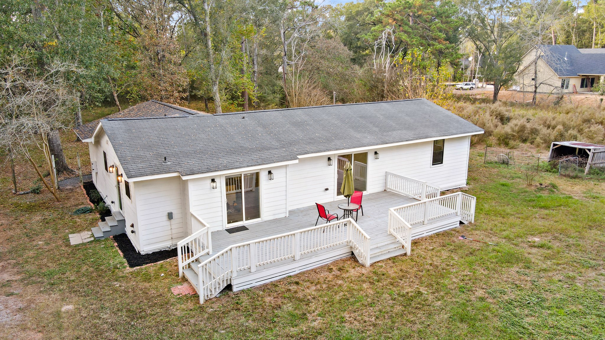 24006 Crooked Creek Road Hockley, TX 77447 - Photo 23 of 25 aerial view of a house with yard and trees in the background