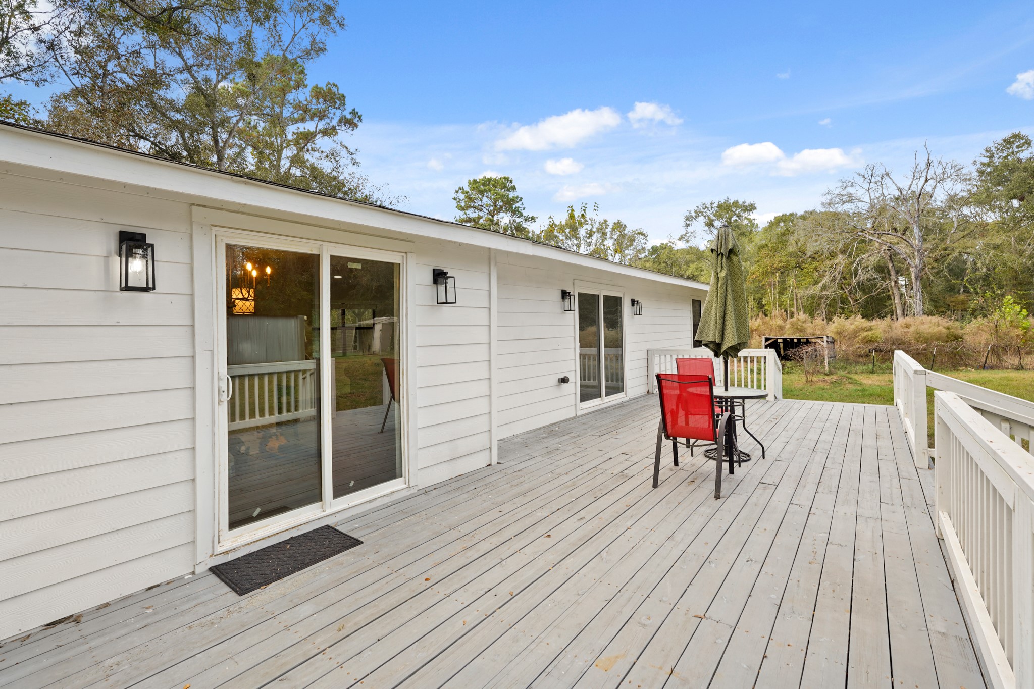 24006 Crooked Creek Road Hockley, TX 77447 - Photo 24 of 25 a view of a deck with wooden floor and seating space