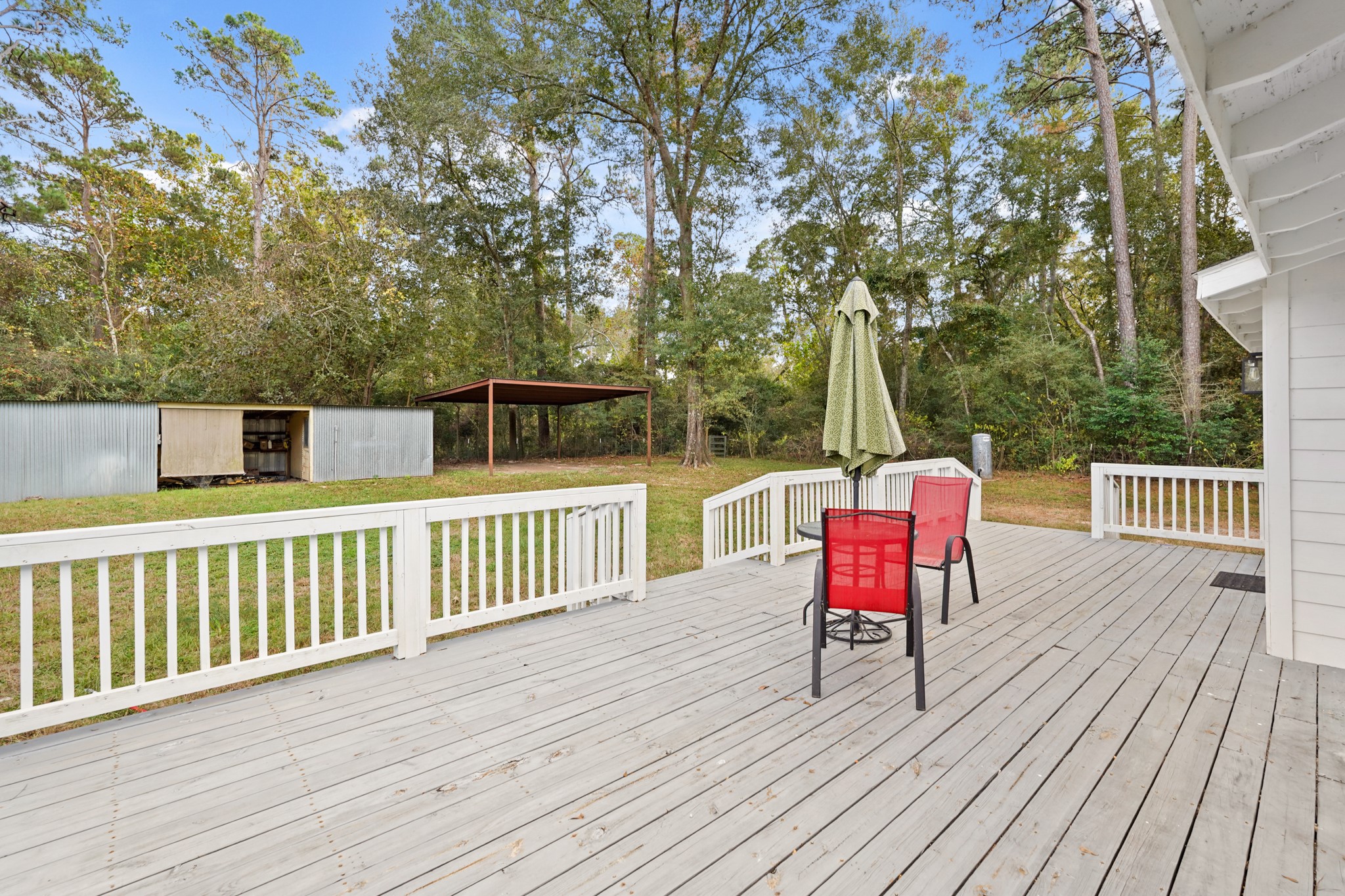 24006 Crooked Creek Road Hockley, TX 77447 - Photo 25 of 25 a view of a deck with furniture and wooden floor