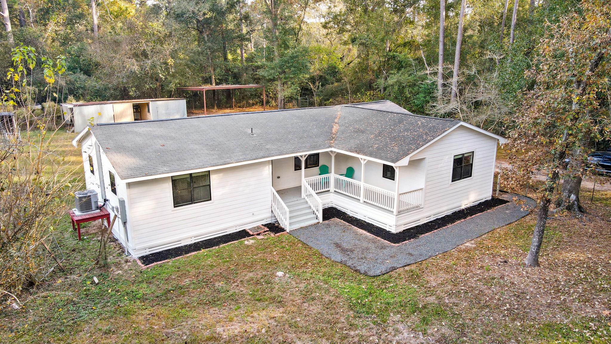 24006 Crooked Creek Road Hockley, TX 77447 - Photo 3 of 25 a house with trees in the background