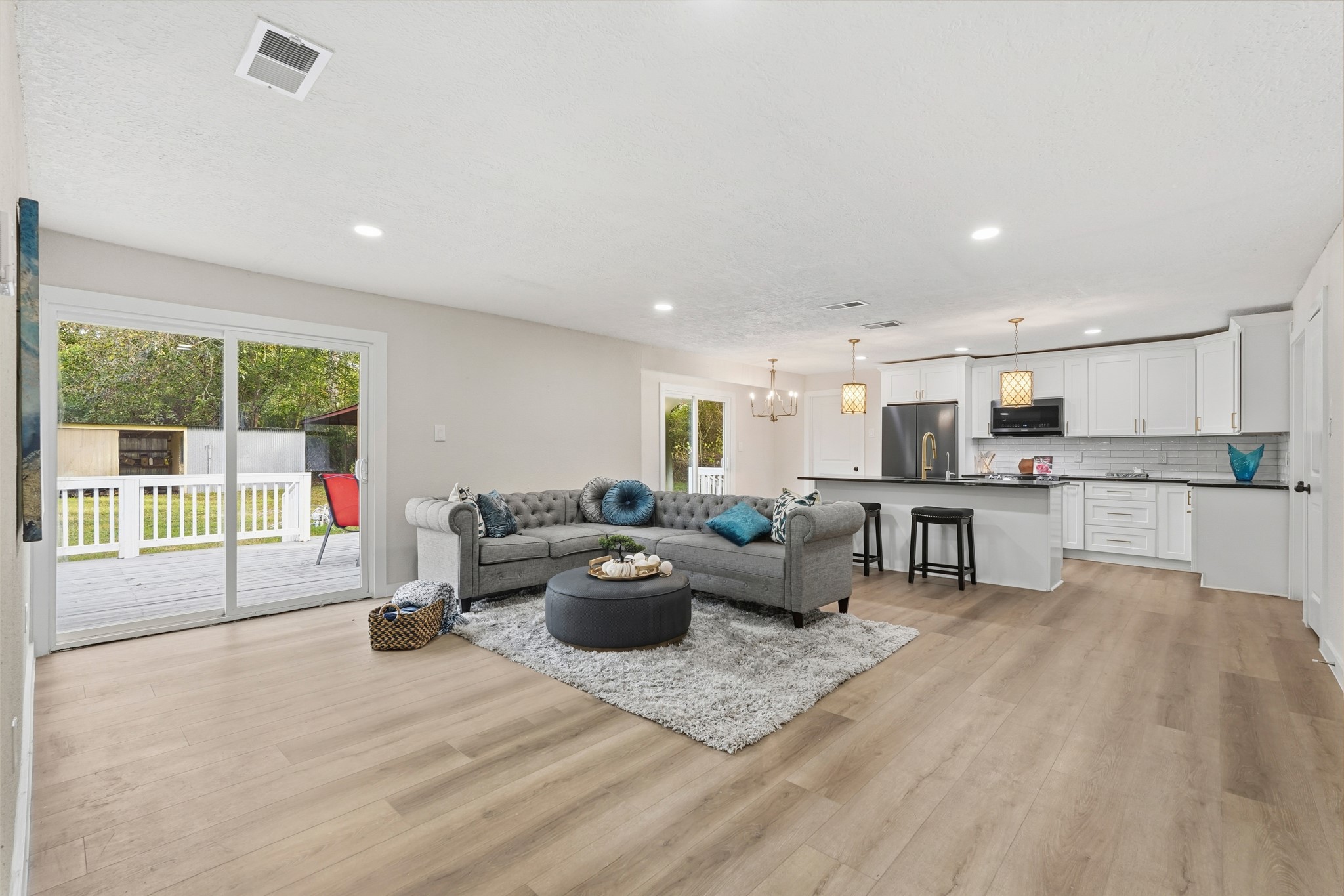 24006 Crooked Creek Road Hockley, TX 77447 - Photo 6 of 25 a living room with furniture and a wooden floor