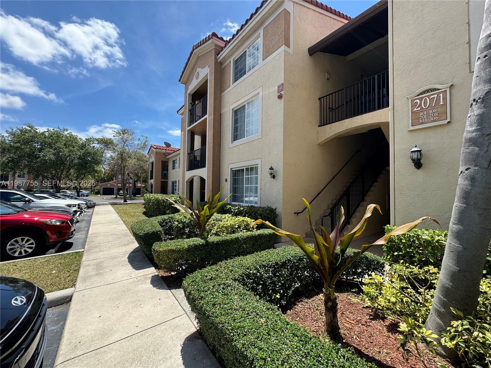 2071 Renaissance Boulevard, Unit 104 Miramar, FL 33025 - Photo 4 of 17 a view of an house with backyard and sitting area