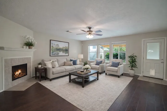 a living room with furniture and a fireplace