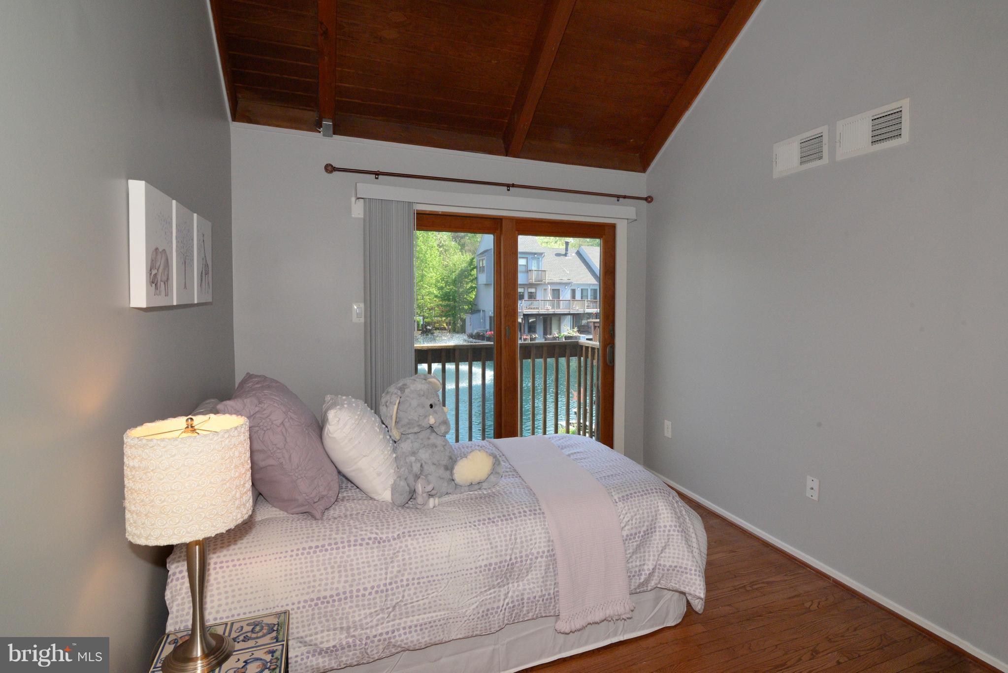 11149 Timberhead Court Reston, VA 20191 - Photo 13 of 30 Bedroom #3 with vaulted ceiling and balcony.