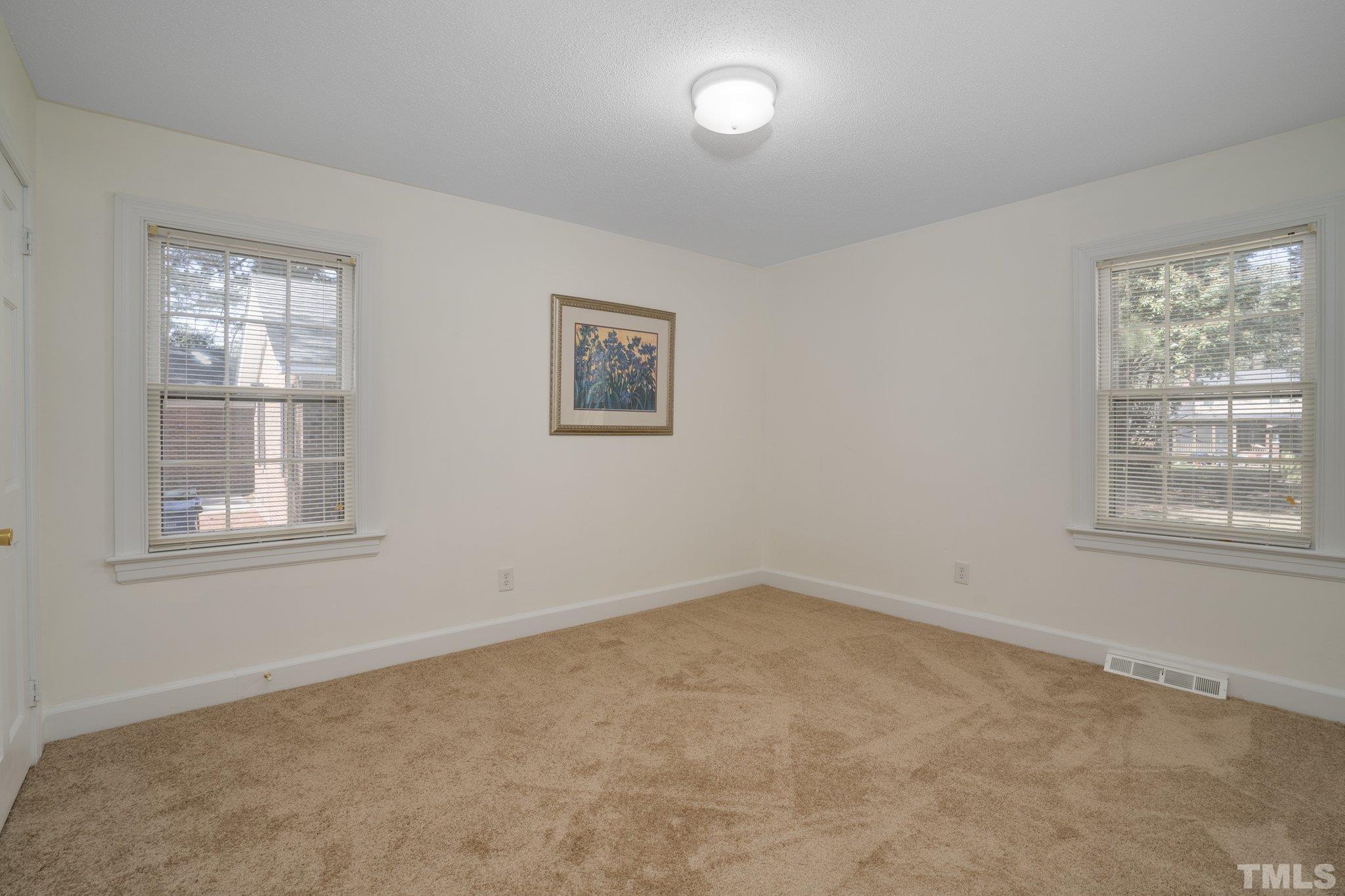 1106 Raleigh Rd Parkway West Wilson, NC 27896 - Photo 11 of 22 an empty room with windows