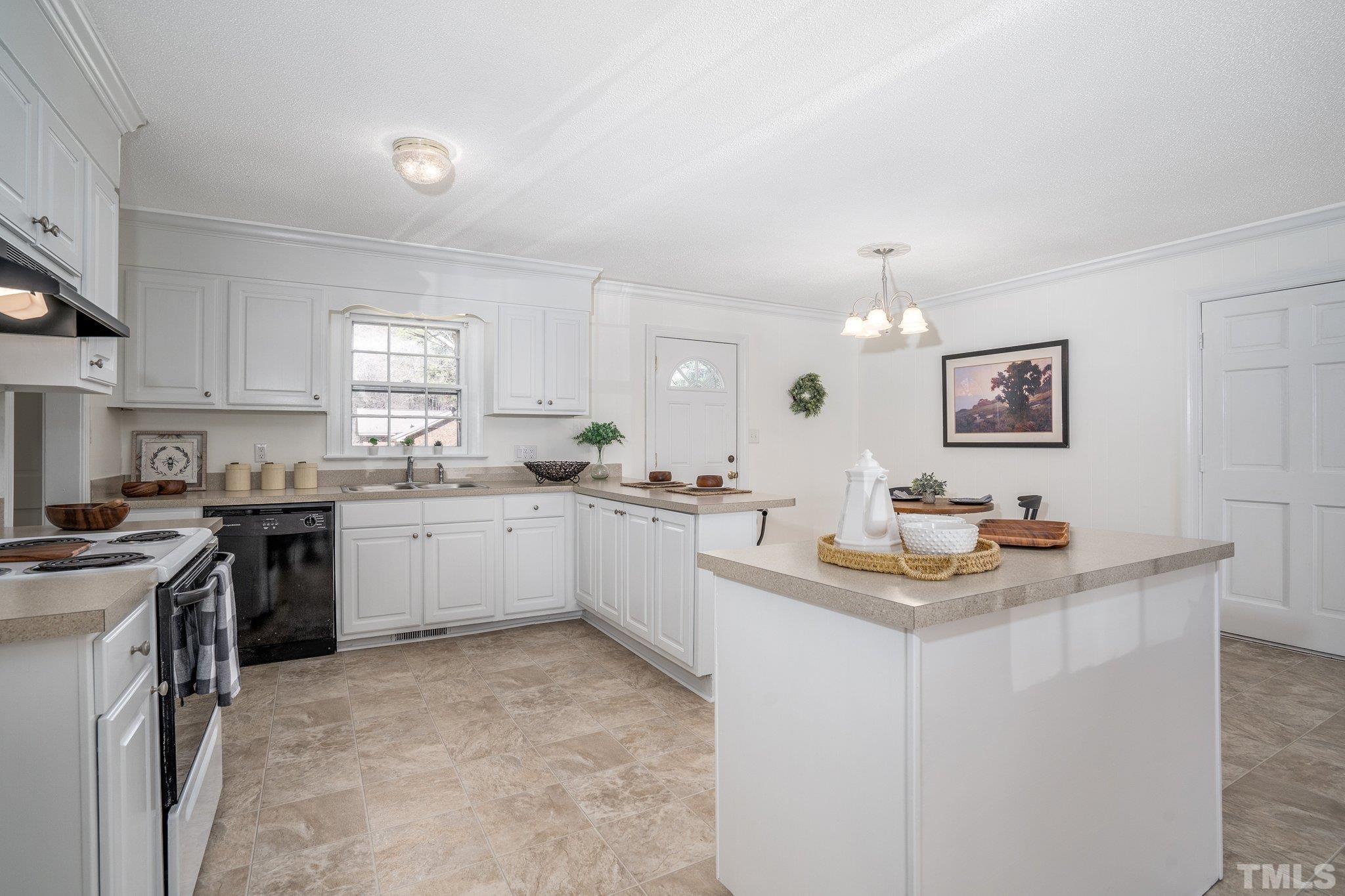 1106 Raleigh Rd Parkway West Wilson, NC 27896 - Photo 14 of 22 a kitchen with a sink stove and cabinets