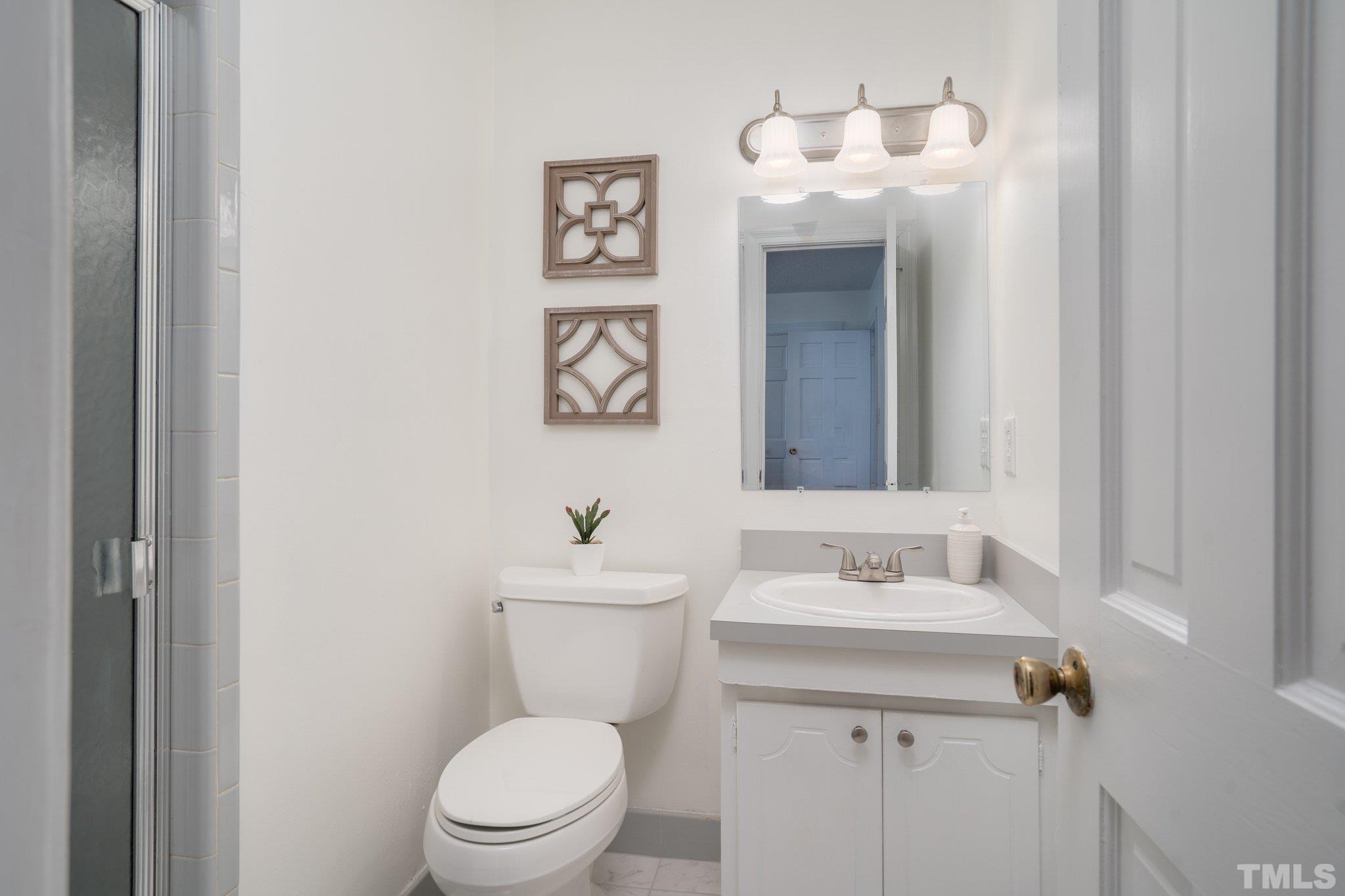1106 Raleigh Rd Parkway West Wilson, NC 27896 - Photo 18 of 22 a bathroom with a toilet sink and mirror