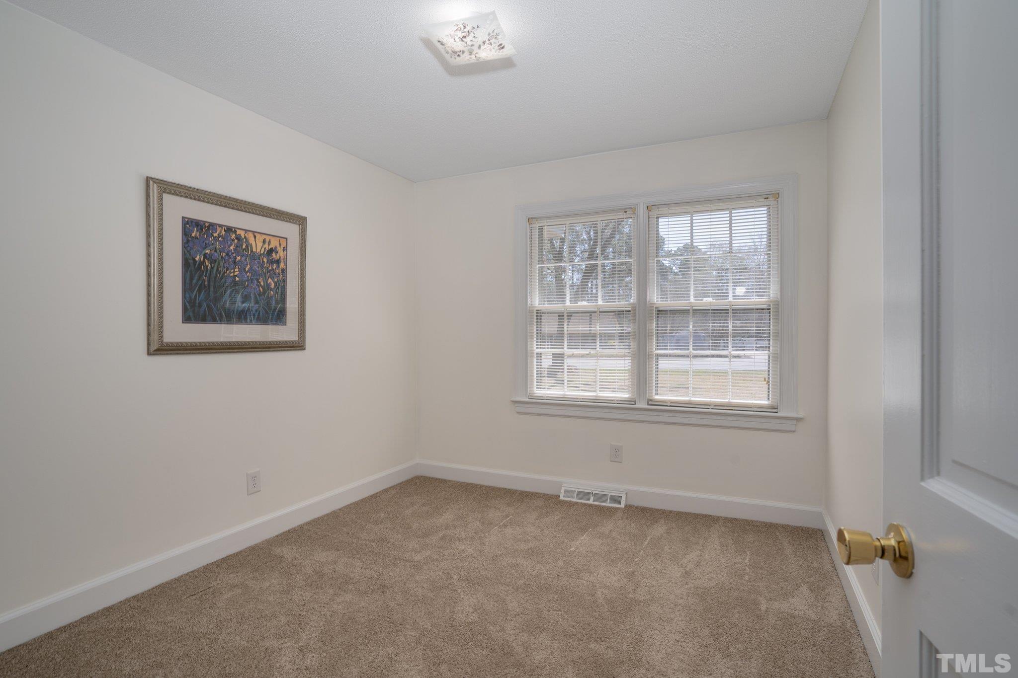 1106 Raleigh Rd Parkway West Wilson, NC 27896 - Photo 19 of 22 an empty room with a window