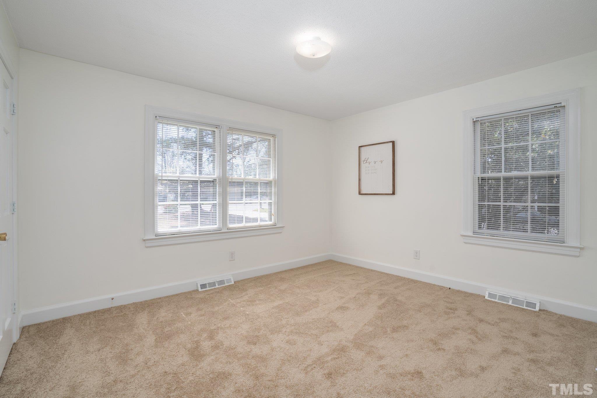1106 Raleigh Rd Parkway West Wilson, NC 27896 - Photo 20 of 22 an empty room with windows