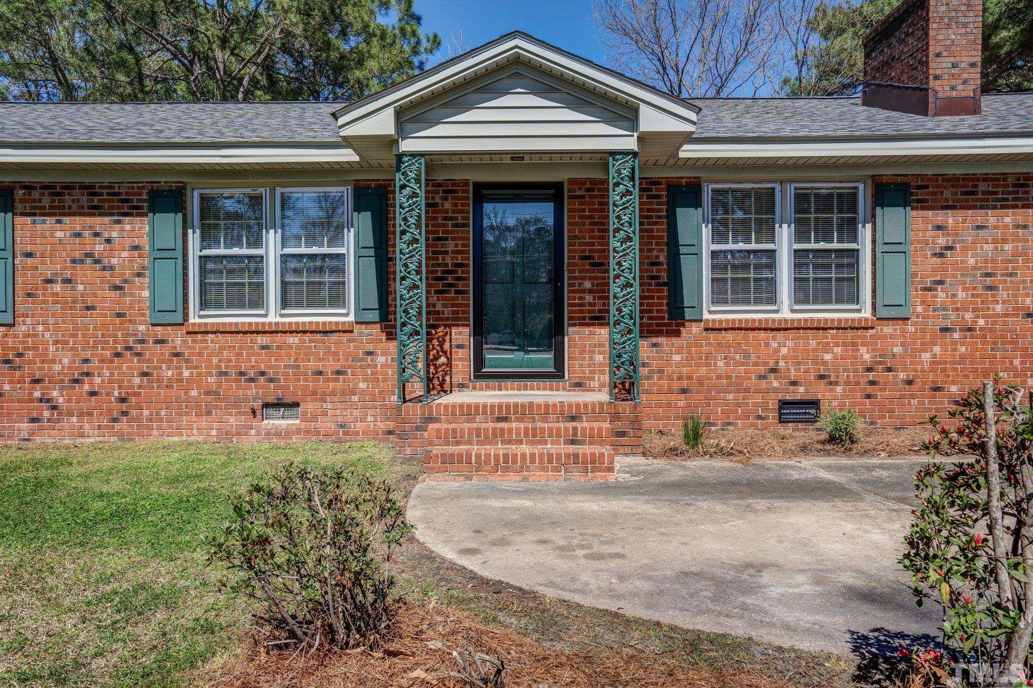 1106 Raleigh Rd Parkway West Wilson, NC 27896 - Photo 2 of 22 a front view of a house with a yard