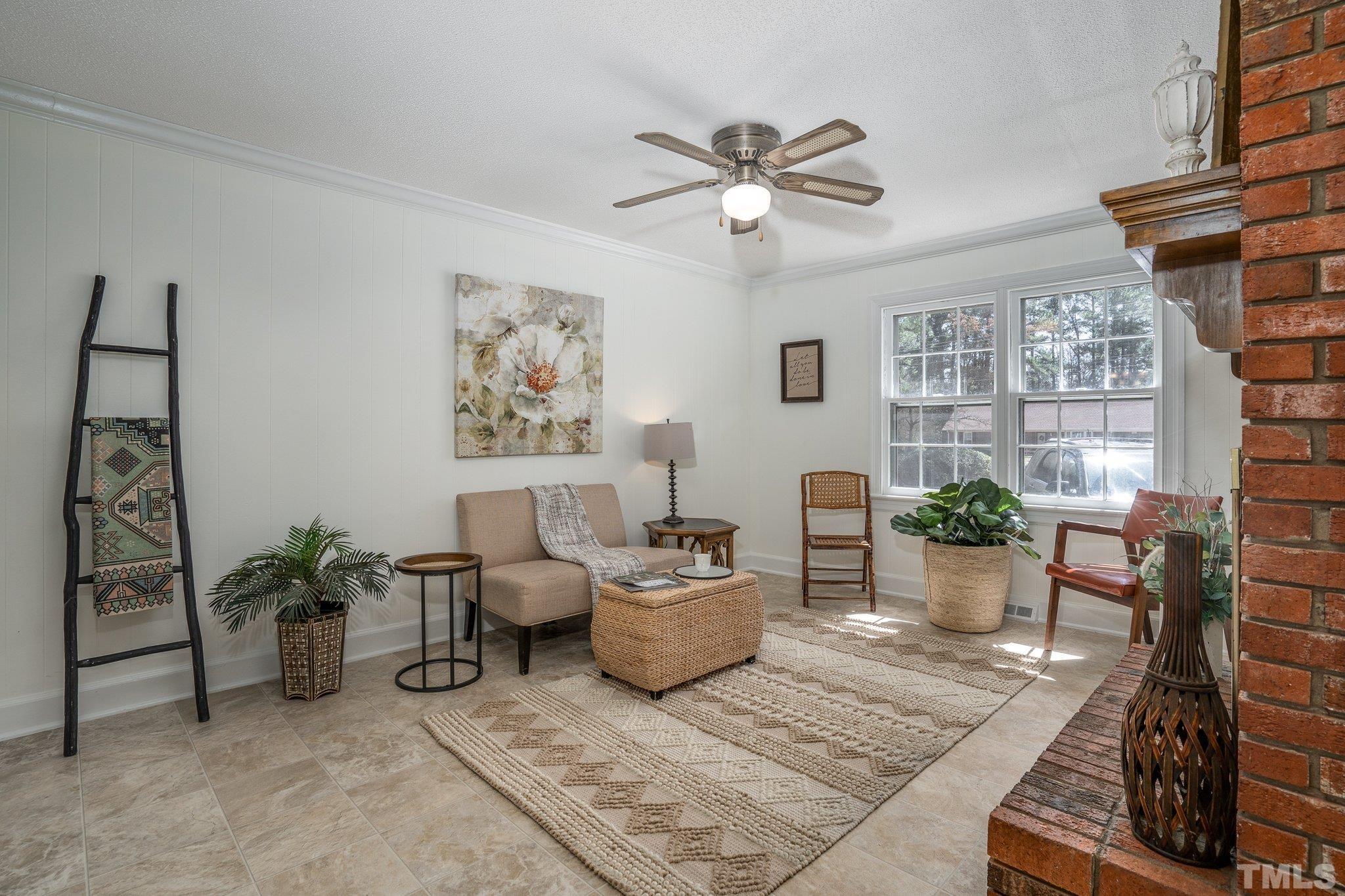 1106 Raleigh Rd Parkway West Wilson, NC 27896 - Photo 6 of 22 a living room with furniture a window and a potted plant