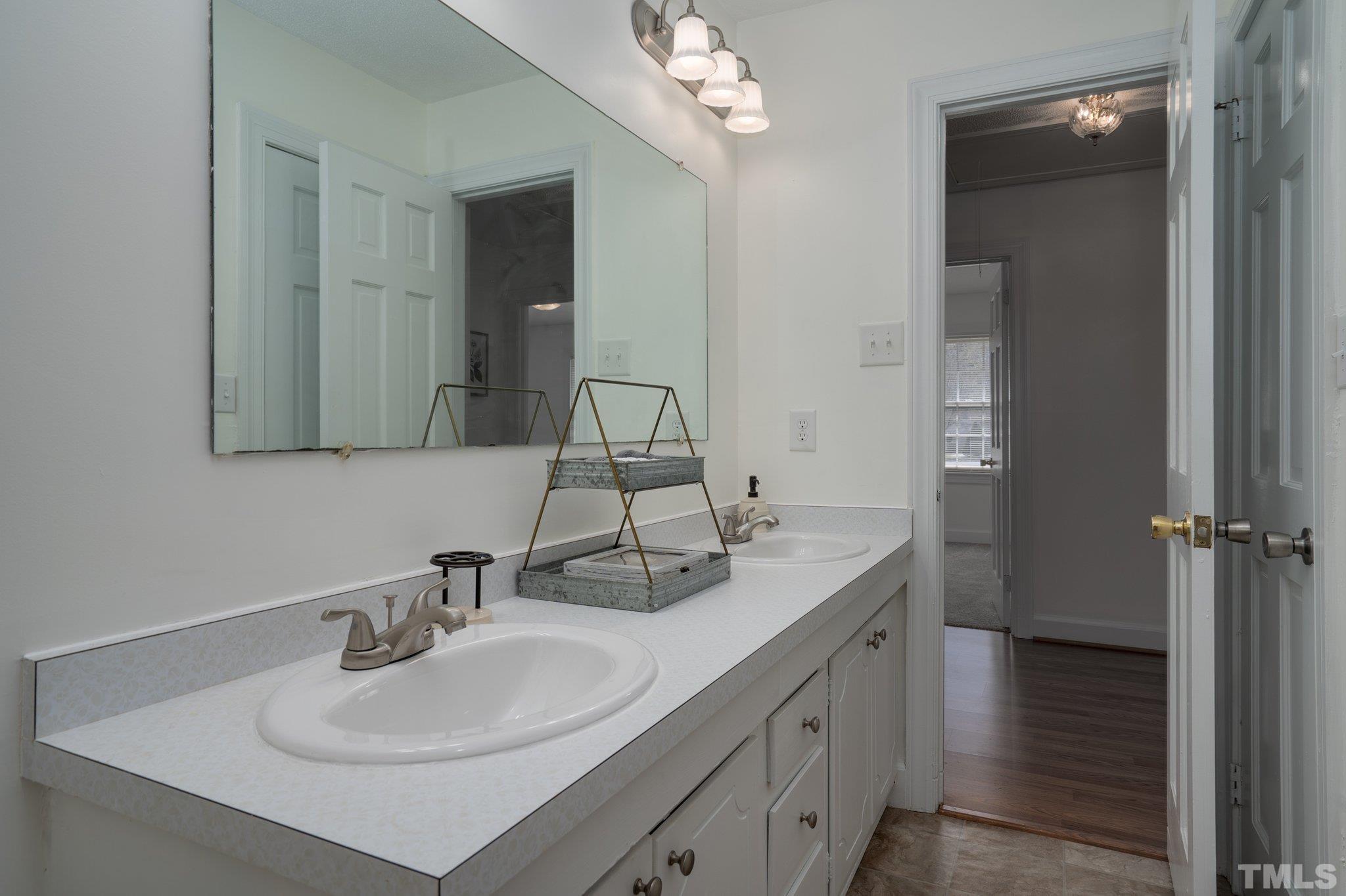 1106 Raleigh Rd Parkway West Wilson, NC 27896 - Photo 10 of 22 a bathroom with a sink double vanity and a mirror