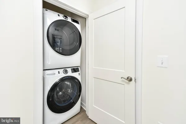 a view of a hallway with washer and dryer