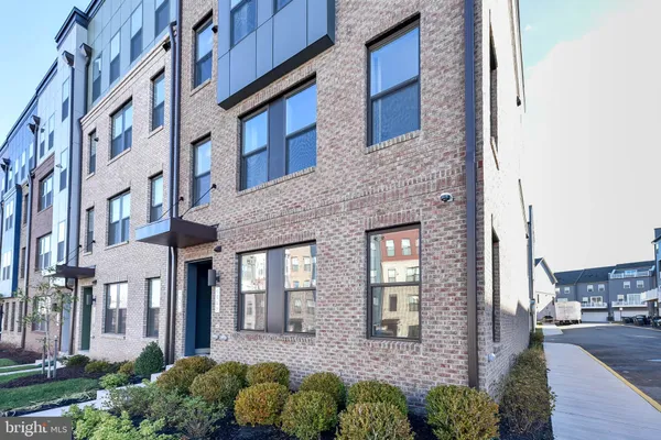a front view of a brick building with many windows