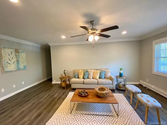 a bedroom with furniture and a rug