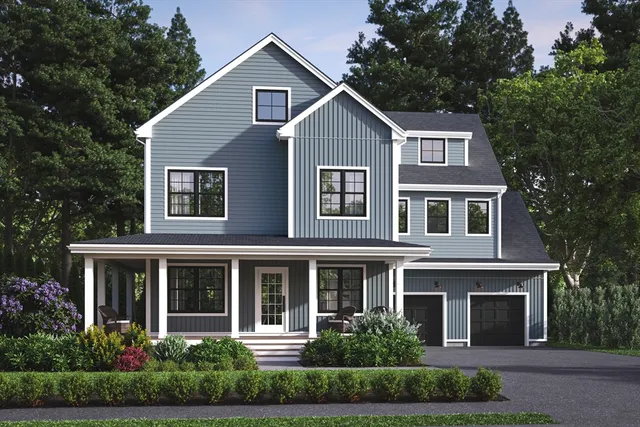 a front view of a house with a yard and green space