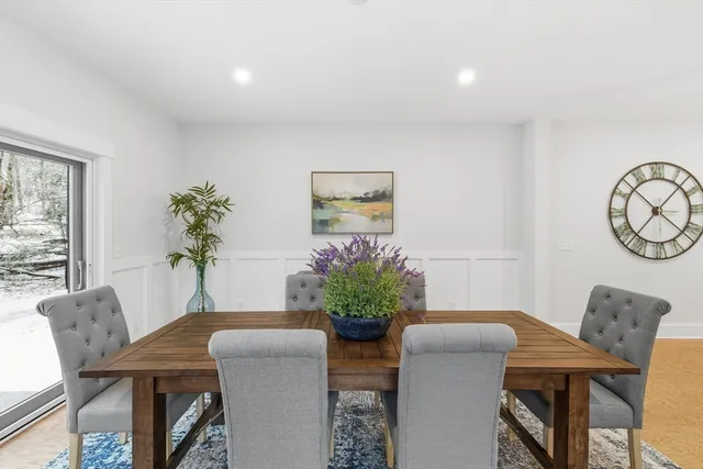 an empty room with wooden floor and staircase
