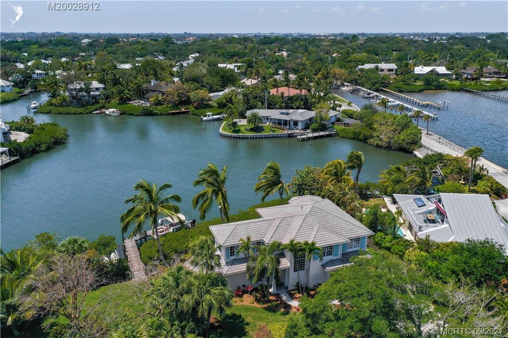 13 Simara Street Stuart, FL 34996 - Photo 4 of 37 an aerial view of residential houses with outdoor space and lake view