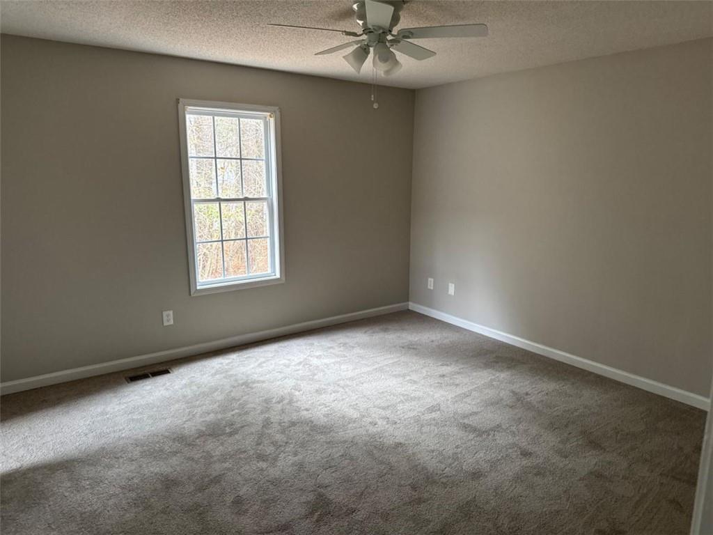 380 River Trace Drive Villa Rica, GA 30180 - Photo 4 of 12 an empty room with a window