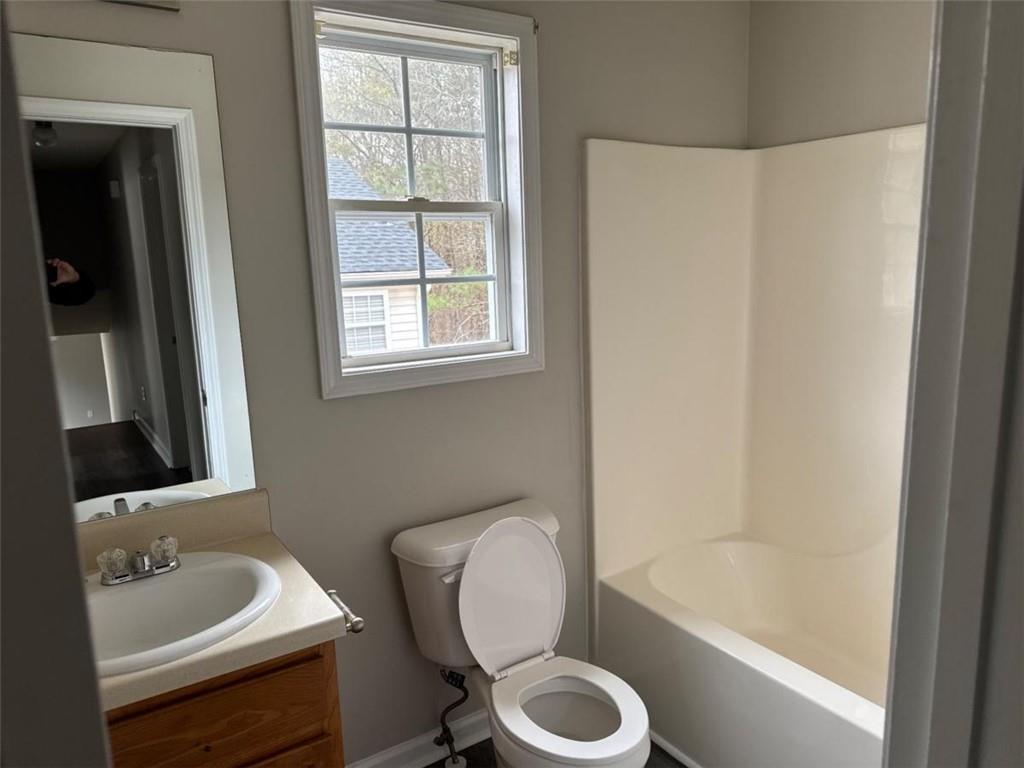 380 River Trace Drive Villa Rica, GA 30180 - Photo 5 of 12 a bathroom with a sink a toilet and a bathtub