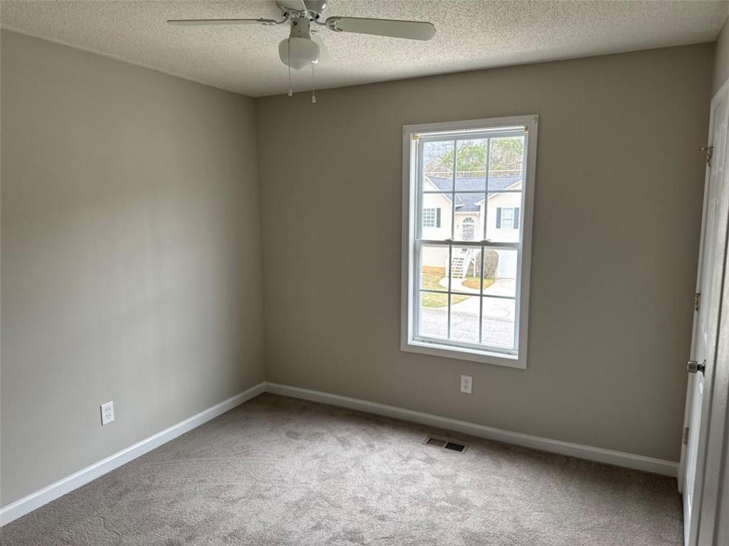 380 River Trace Drive Villa Rica, GA 30180 - Photo 7 of 12 an empty room with a window