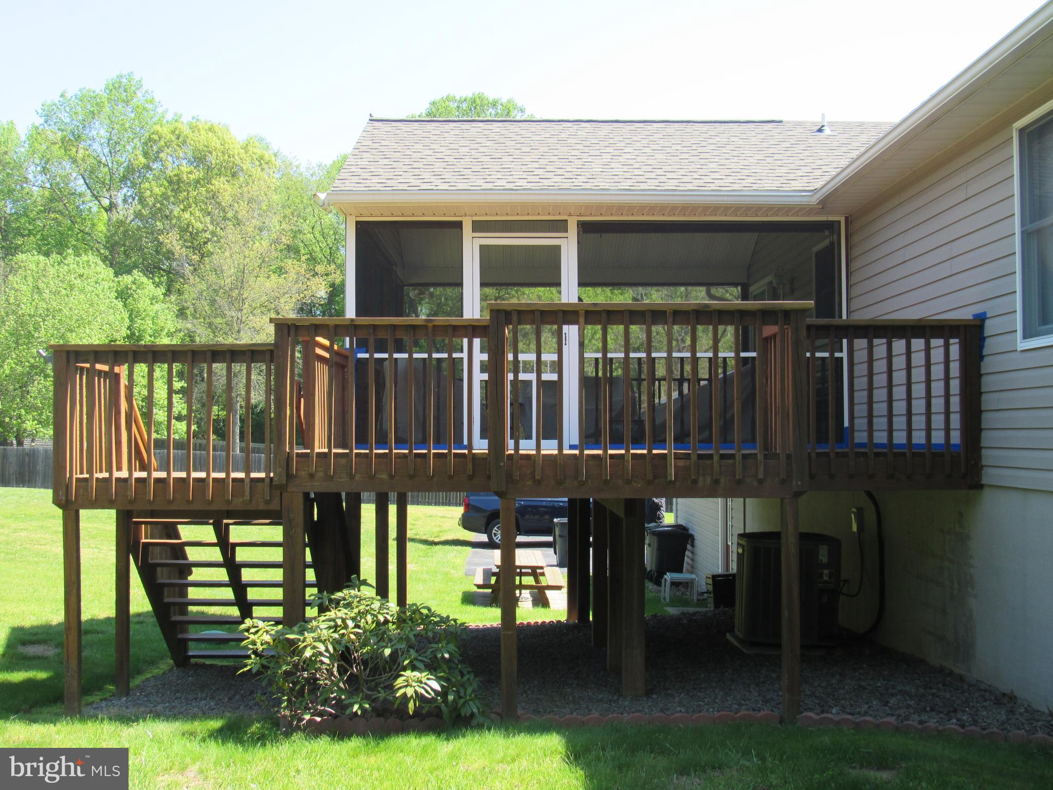 1451 Oldfield Point Road Elkton, MD 21921 - Photo 14 of 51 Side view of deck with steps to backyard