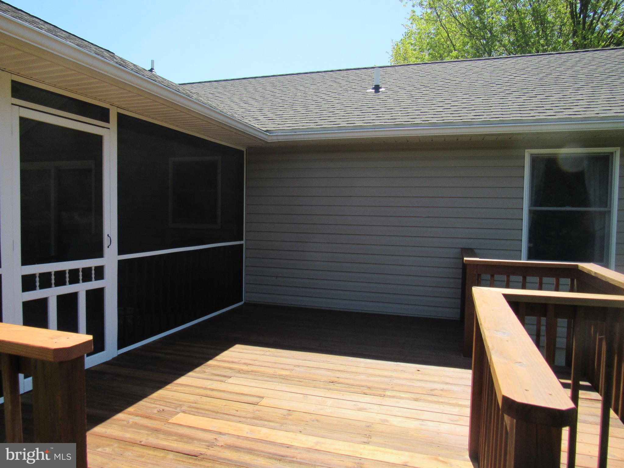 1451 Oldfield Point Road Elkton, MD 21921 - Photo 17 of 51 Access the deck from the screened porch