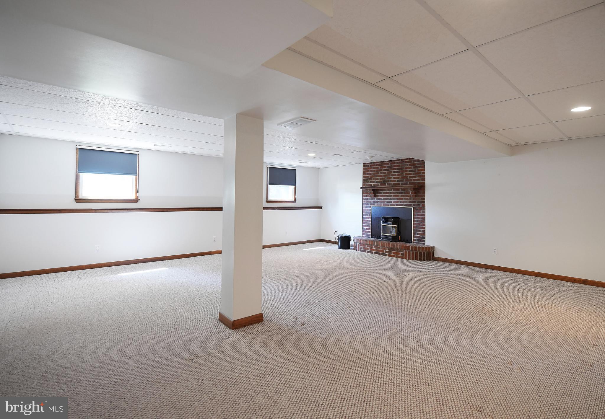 1451 Oldfield Point Road Elkton, MD 21921 - Photo 31 of 51 2 windows allow plenty of natural light in rec rm