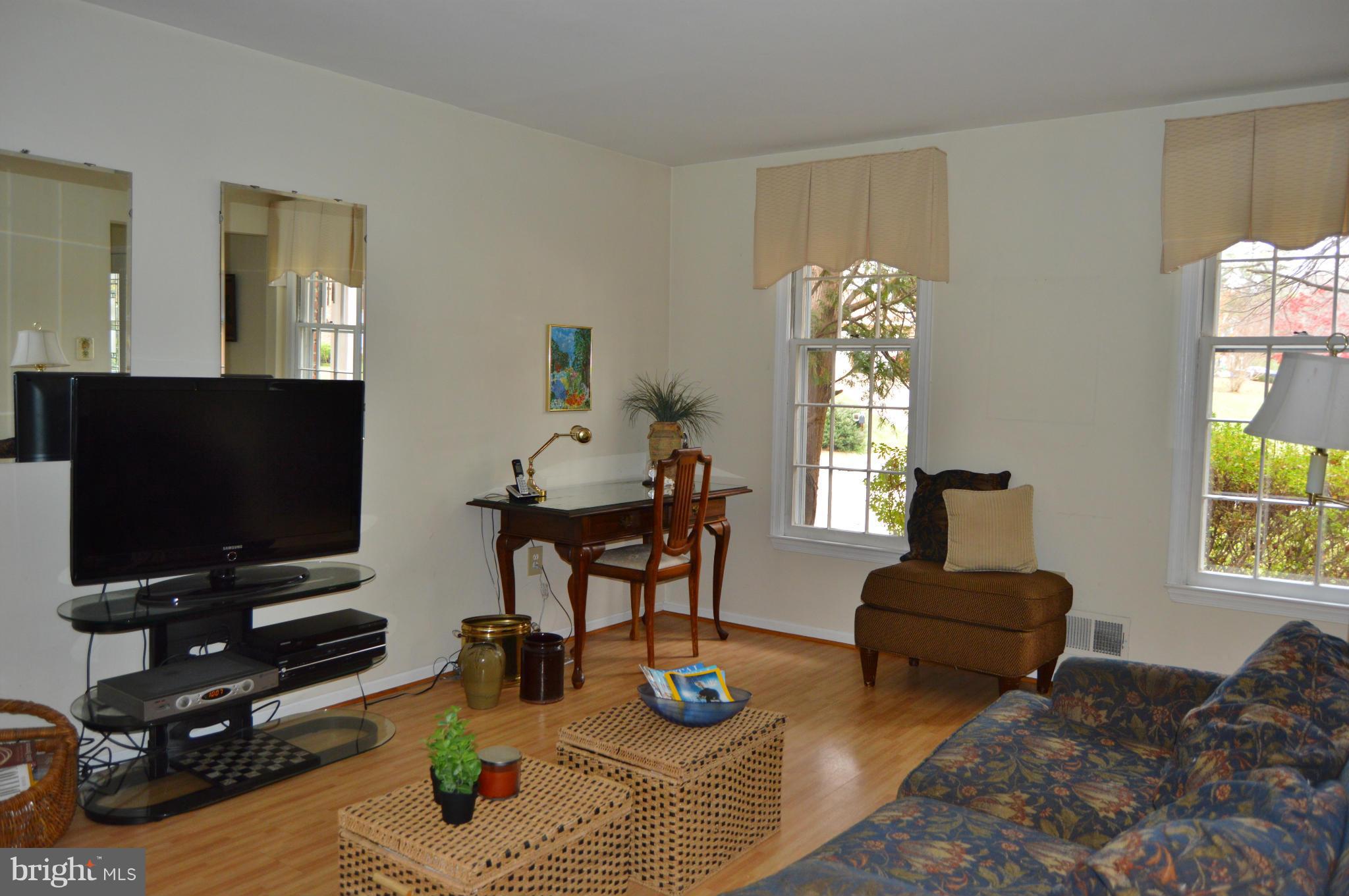 2017 Hopefield Road Silver Spring, MD 20905 - Photo 12 of 30 a living room with furniture a flat screen tv and a window