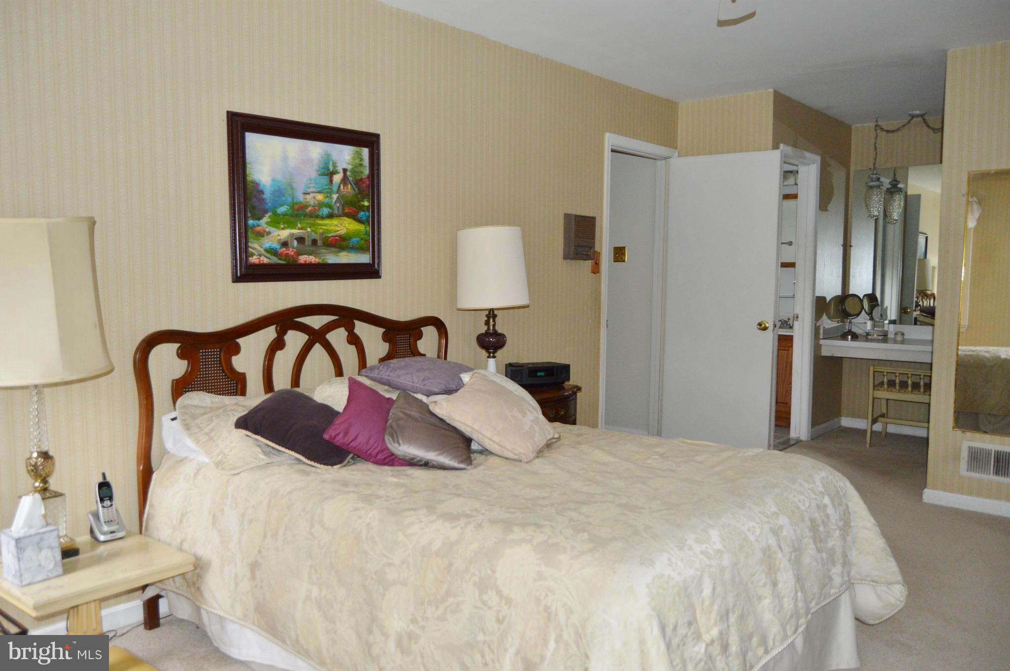 2017 Hopefield Road Silver Spring, MD 20905 - Photo 14 of 30 a bedroom with a bed and a desk