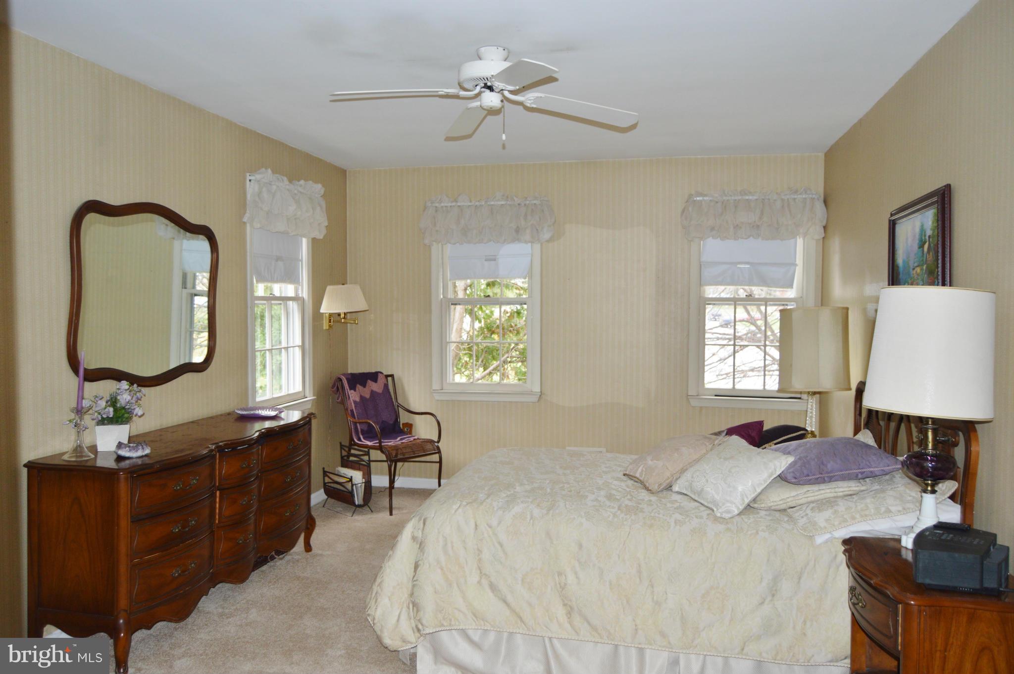 2017 Hopefield Road Silver Spring, MD 20905 - Photo 15 of 30 a bedroom with a bed window and wall painting