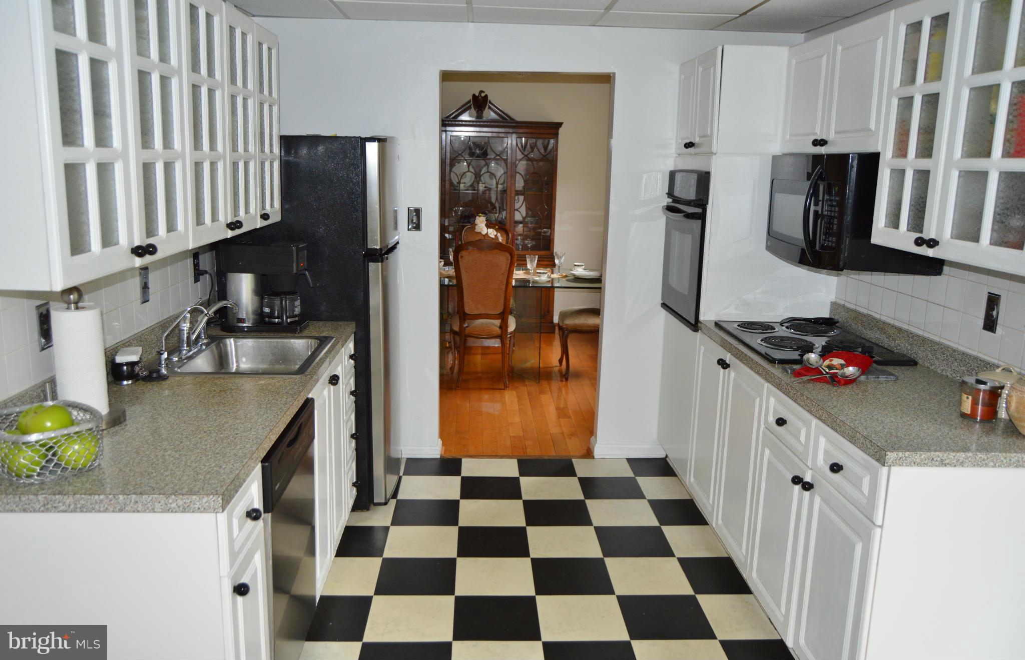 2017 Hopefield Road Silver Spring, MD 20905 - Photo 3 of 30 a kitchen with stainless steel appliances granite countertop a refrigerator and a stove top oven