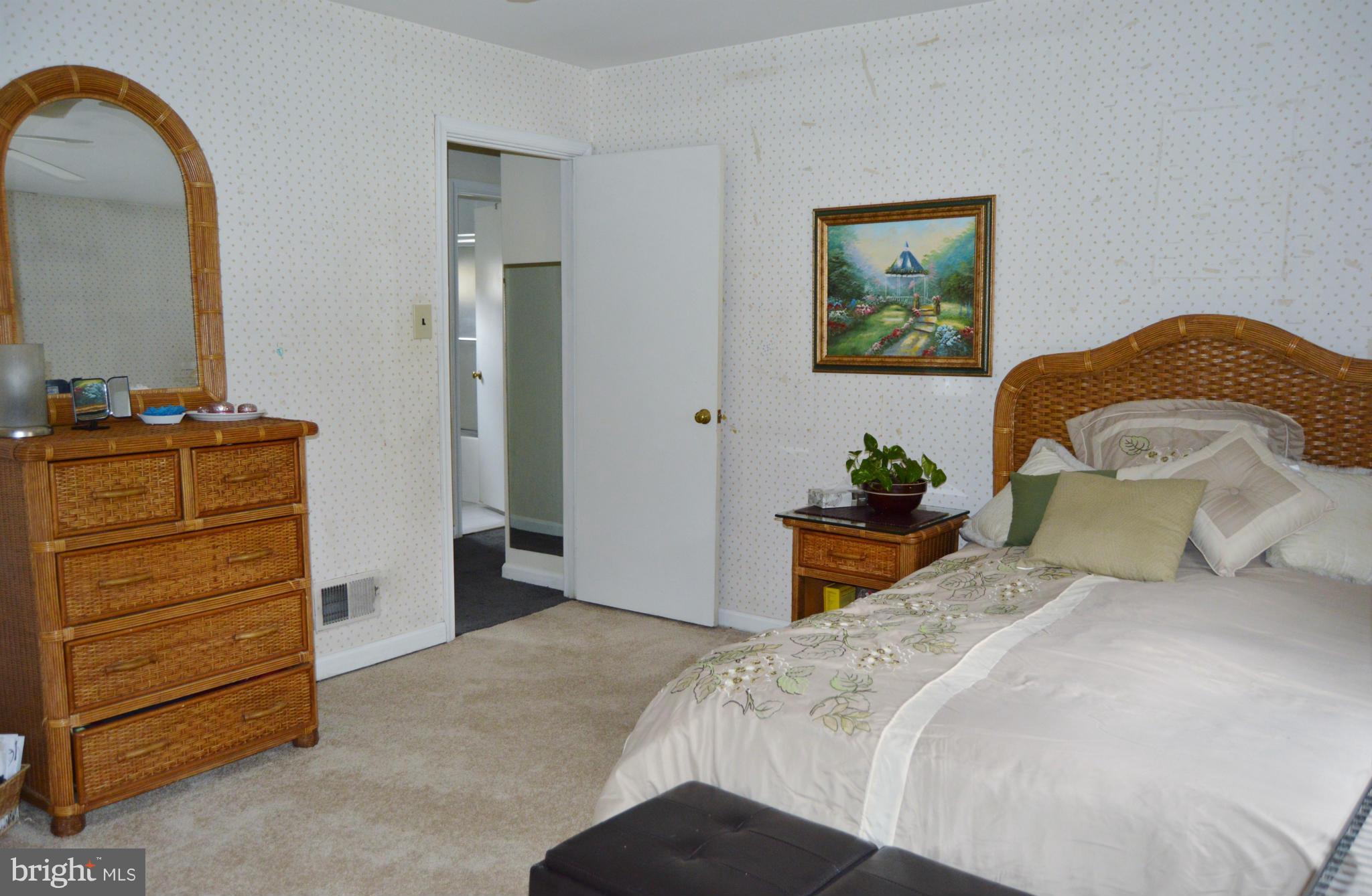 2017 Hopefield Road Silver Spring, MD 20905 - Photo 22 of 30 a bedroom with a bed and a dresser
