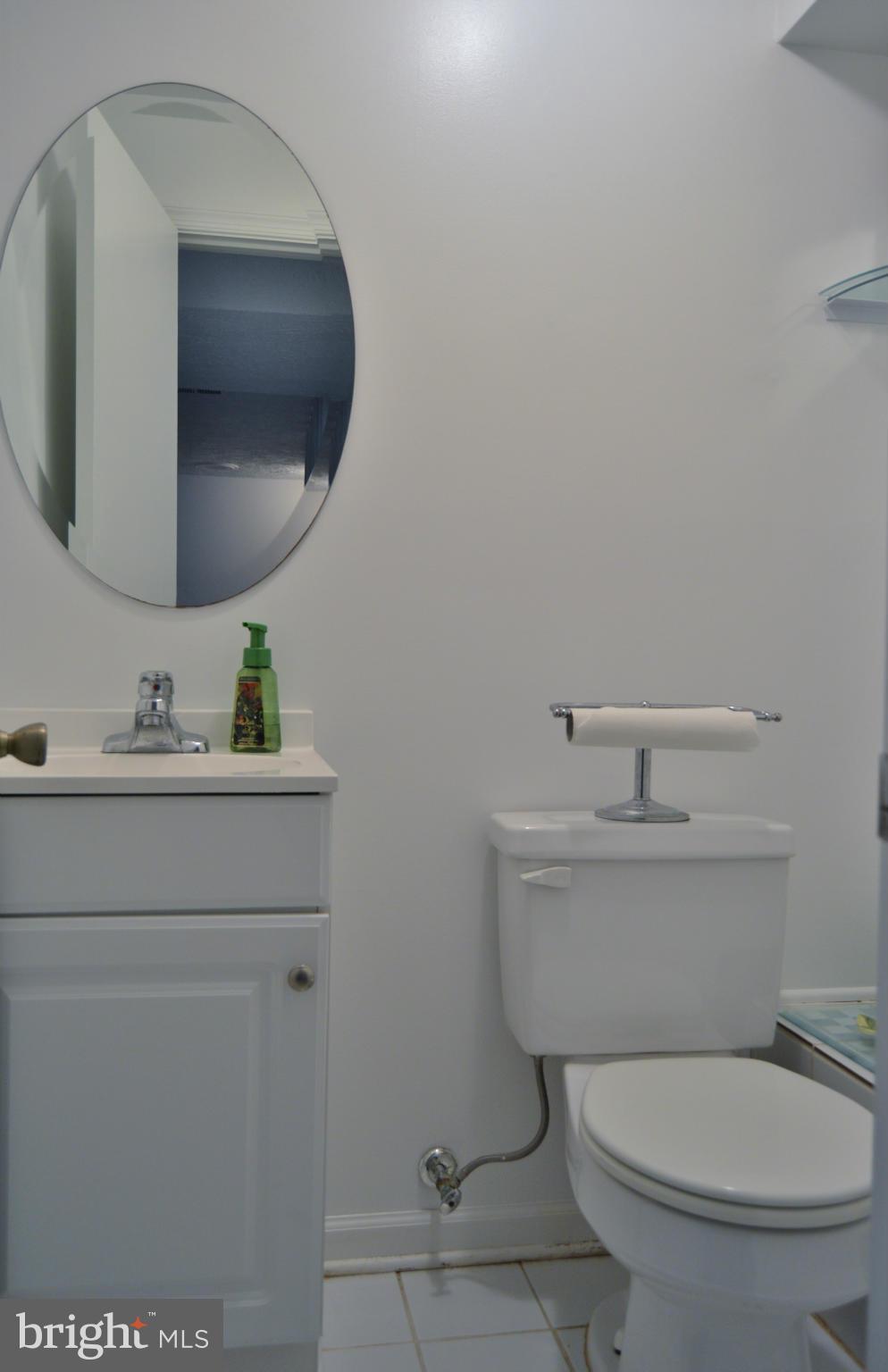 2017 Hopefield Road Silver Spring, MD 20905 - Photo 26 of 30 a bathroom with a toilet a sink and mirror