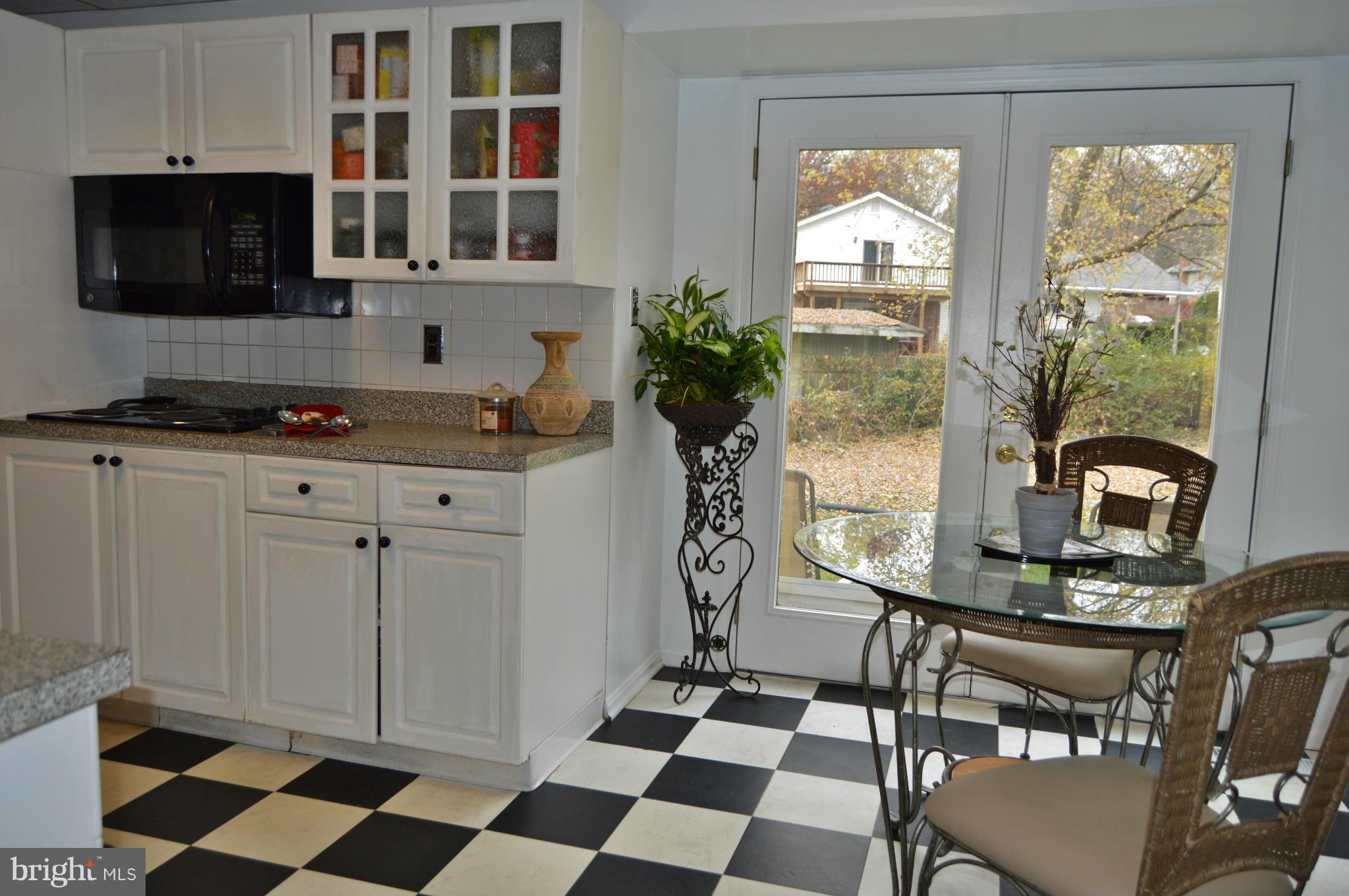 2017 Hopefield Road Silver Spring, MD 20905 - Photo 4 of 30 a kitchen with stainless steel appliances a stove a sink and a microwave