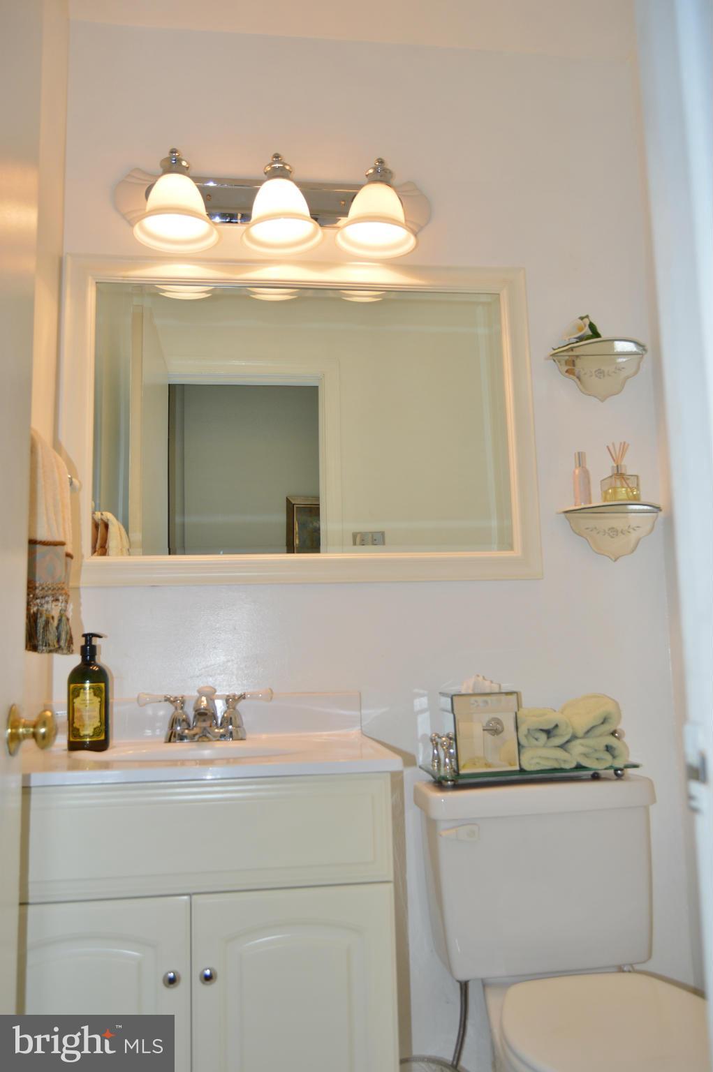 2017 Hopefield Road Silver Spring, MD 20905 - Photo 10 of 30 a bathroom with a toilet sink and mirror